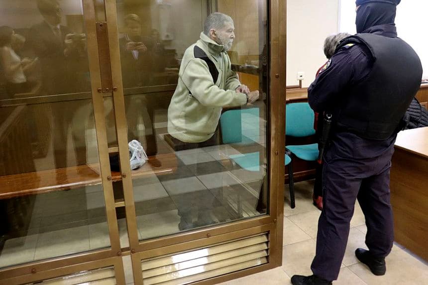 In this photo released by the Moscow City Court Press Service, Stephen Hubbard, a US citizen accused of fighting as a mercenary in Ukraine against Russia stands in a glass cage during a court session in the Moscow City court on Monday, Oct. 7, 2024.